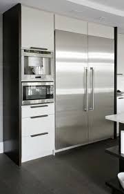 Stainless Steel Appliances Contrast Against White Cabinetry Also Integrated Appliances White Modern Kitchen Modern Kitchen Design Outdoor Kitchen Appliances