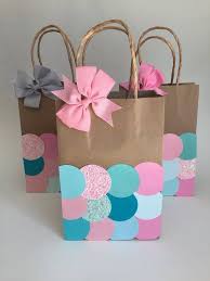 Baby 1st Birthday Goodie Bag Ideas These Adorable Mermaid Gift Bags Actually Contain A Special Surprise For Each Party Guest The Bow On The Bag Is Actu Gift Bags Diy Mermaid Gifts Mermaid Favor