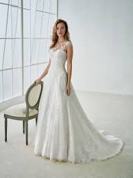 Sophisticated Wedding Dress In Tulle And Lace A Design That Combines An A Line Skirt With An Illu Wedding Dresses Bridal Dresses Sophisticated Wedding Dresses