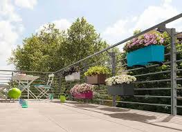 It helps you complement the appearance of your home while offering a adjustable bracket designed to fit over a 2×4 or 2×6 wood railing. Railing Planters Bring Color To Small Outdoor Living Spaces