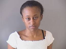 Tulsa County deputies arrest a woman for child abuse after they say she  forcefully slammed her baby onto the floor at the County Courthouse between  the counters at the Tulsa Sheriff's secuity