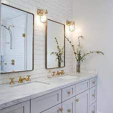 This bathroom goes all out with a precious metal theme and offers up a fresh take on bathroom double sink vanity ideas. Cb2 Hexagon Brass Drawer Pull Design Ideas
