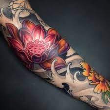 Some specific flowers have come to have many meanings in various cultures. Amazing Japanese Tattoo Design With Lotus Tattoo Design In Hand Tattoo Ideas Mas Tattoo Styles Tattoos Japanese Flower Tattoo