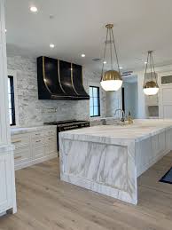 When adding a kitchen island you not only need to consider the kitchen island size but also the determine the ideal island size for your cook space renovation, then consider your family's lifestyle to. White Kitchen With Marble Island White Marble Kitchen Dream Kitchens Design White Interior Design
