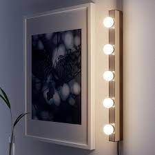 Cue looking at lighted vanity mirrors, which surprise surprise, are hella expensive. Musik Chrome Plated Wall Lamp Ikea