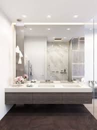 Modern Bathroom With Dark Woods White Marble And A Mirror Wall Bathroom Mirror Design Big Bathrooms Small Bathroom Mirrors