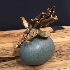 A picture i took of my dragon head statue that i own, the quailitys kinda bad since i used a webcam to take the shot. Head Hatcher One Of A Kind Dragon Egg Sculpture By Dennis Thompson