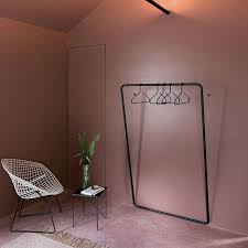 Schoenbuch S Curve Coat Rail Is Impressively Practical And Understated The Metal Frame Is Powder Coated In Black And Ancho Design Boutique Interior Interior