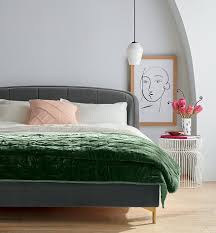 Comfortable double bed in modern stylish bedroom. The Best In Mid Century Bedding