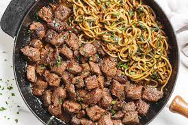70+ easiest recipes to make in a cast iron skillet. Garlic Butter Steak Bites Recipe Garlic Butter Steak Bites With Lemon Zucchini Noodles Eatwell101