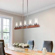 Your chandelier should be centered over your dining table, even if the dining table is not centered within the room. Modern Farmhouse 5 Light Wood Linear Chandeliers Island Lights For Dining Room L42 9 X W3 9 X H9 4 Overstock 25454912