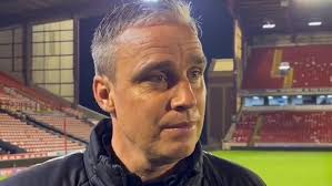 Barnsley boss Michael Duff swigs beer after reaching League 1 play-off final