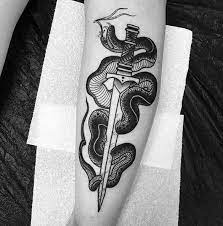 By the admirers and the lovers of snakes, the meanings of snake tattoos can symbolize a variety of characteristics and meanings. 50 Snake Dagger Tattoo Ideas For Men Sharp Serpent Designs