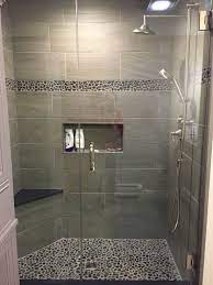 Get a fresh perspective for this online shopping industry. Charcoal Black Pebble Tile Border Shower Accent Bathroom Remodel Shower Bathrooms Remodel Bathroom Remodel Master