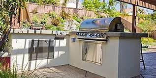 This involved constructing bases of steel studs, hardipanel, synthetic stucco and poured concrete countertops that would hold a natural gas grill and provide storage and space for foo… Stucco Outdoor Kitchen Landscaping Network