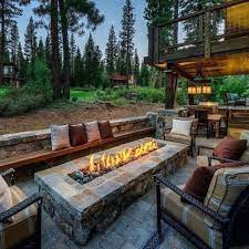 This rustic fire pit chair manages to pair a traditional country look with something a bit more unusual with its slightly curved aesthetic. Top 60 Best Outdoor Fire Pit Seating Ideas Backyard Designs