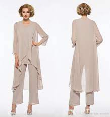 An embellished grey maxi dress plus a sheer shawl over it and grey shoes, statement earrings. Plus Size Mother Of The Bride Pant Suit Chiffon For Beach Wedding Dresses Mothers Dresses Long Sleeves Cheap Mothers Formal Gowns Canada 2021 From Kerr Miranda Mother Of The Bride Suits Wedding