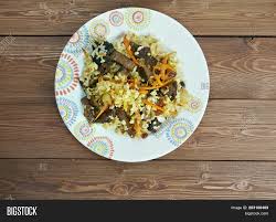 It consists of steamed rice mixed with raisins, carrots, and beef or lamb. Kabuli Palaw Image Photo Free Trial Bigstock