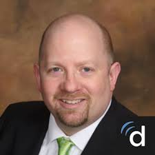 Dr. Daniel E. Bustos, MD