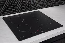 The settings table shows power levels and cooking times for various meals. 24 Induction Cooktop 4 Burner Zones Built In Sensor Touch Panasonic North America Canada