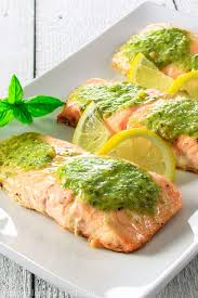 This 15 Minute Pesto Salmon Recipe Is Loaded With Garlicky Pesto Butter And Fresh Lemon Juice Its The Per Pesto Salmon Recipe Pesto Salmon Easy Salmon Recipes
