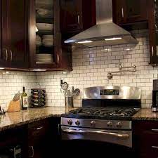 Modern kitchen with dark stain shaker cabinets. Kitchen Backsplash Ideas With Brown Cabinets Marble Backsplash Ideas Design Photos And Pictures Brown Is An Easy Color To Maintain Quickly Hiding Spills And Splashes Foodbloggermania It