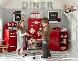 Complete with a sink, icebox and oven, it has a fun retro design with lots of interactive features like adjustable shelves, timers that tick and sign in to your registry with your pottery barn kids account. Red Retro Kitchen Pottery Barn Kids Childrens Playroom Playroom
