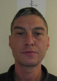 Racist" jailed for setting dog