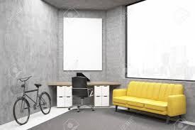 Office With A Large Yellow Sofa Under A Window A Desk With Computer Stock Photo Picture And Royalty Free Image Image 74636794