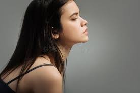 Humourless Long-haired Woman Looking in the Distance Stock Photo