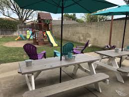 Bought Some 98 Picnic Tables From Lowes And Sanded Them I Painted The Bottom With A Solid Paint Picnic Table Picnic Table Makeover Picnic Table With Umbrella