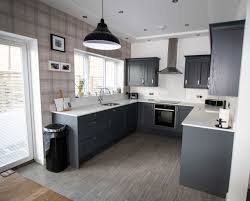 Howdens fitted kitchen, grey gloss, oak block worktop, doors, units, handles. Kew Painted Shaker Kitchen Rugby Noble Kitchens