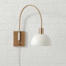 Modern gold wall lamp brass finished plug in wall light with opal white glass shade bathroom vanity sconce. Wall Sconces Plug In And Candle Crate And Barrel