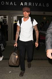 The former footballer, 41, ventured out onto the snow covered pavements in his trademark baker boy camel coloured cap as he held onto his little. David Beckham S Style Evolution Is Something To Behold Vogue