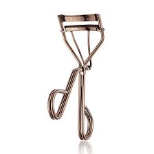 A basic eyelash curler looks somewhat like a pair of scissors with a curved clamp on the end. Artist Eyelash Curler Laura Mercier