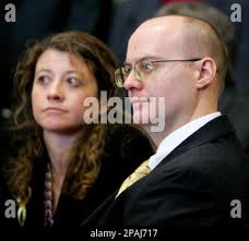 Timothy Masters, right, and his attorney Maria Liu listen in district court  as Judge Joseph Weatherby overturned Masters' murder conviction and set  aside Masters' life prison sentence in Fort Collins, Colo., on