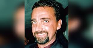 Obituary information for James "Rusty" Burke, Jr.