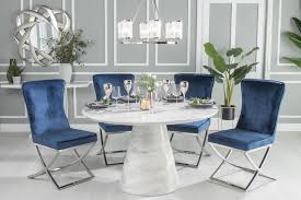 The 'x' style base of the table takes the design of this table to the next level. Urban Deco Carrera 130cm White Marble Dining Table And 4 Lyon Blue Chairs Cfs Furniture Uk