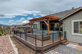 Pergola on deck with railing. Decks And Outdoor Living Stewart Remodeling