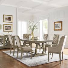 • features tufting and metal nailheads finished in antique bronze accentuate seat edge… The Gray Barn Camilla Trestle Base Dining Table With Cream Tufted Nailhead Dining Chair Overstock 26279464