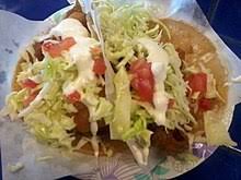 Blackened fish, chile lime sauce, shredded cabbage mix, topped with pineapple relish. Taco Wikipedia