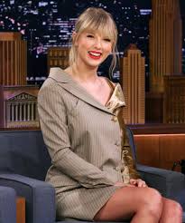 Taylor swift was pictured on a beach wading into the water. Taylor Swift Transforms Into The Man In New Music Video