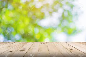 Green Leaf Blurred And Wood Table For Nature Background Green Nature Wallpaper Nature Wallpaper Rustic Wallpaper