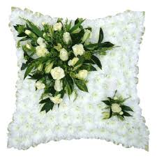 The sweetly scented flower has tiny, delicate bell shaped blooms that are protected by broad leaves. Funeral Flowers White Cream Funeral Cushion