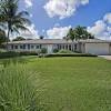 This includes using signature elements such as stucco exterior walls, red tile hip roofs, and grand arched entryways that usually include columns on either side. 1