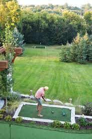 Mom's Design Build-| Backyard Golf Green And Bar With A Pavilion And  Masonry Oven