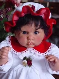 Weighted doll with olive complexion and dark hair