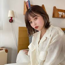 Straight cut shaggy bob with bangs. 10 Flattering Short Hairstyles With Bangs To Try