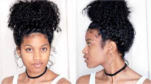 Leave the bangs to fall loosely around your face and create a messy low bun underneath the braid. Big Messy Curly Bun Tutorial On Natural Hair Youtube