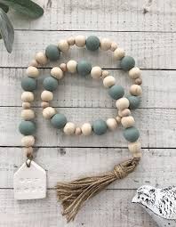 Our Nest Wooden Bead Farmhouse Decor Garland In 2021 Wood Beads Diy Wood Bead Garland Beaded Garland